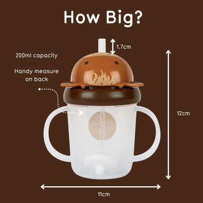 A sippy cup with a lid and straw shown on a brown background with measurement labels and arrows indicating dimensions: 12 cm tall, 11 cm wide, and 1.7 cm straw opening.