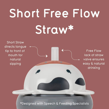 A product infographic for a Short Free Flow Straw sippy cup. The image features a white and black cow-themed lid with a short straw on top, set against a dusty rose background with white text and dotted arrows explaining the design benefits.