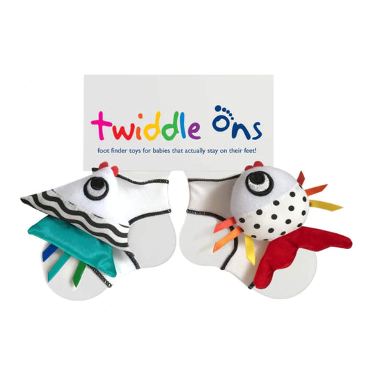Twiddle Ons Foot Finder Toy pair with contrasting patterns, soft fabric textures, and attached foot rattle toys designed to stay on baby’s feet.