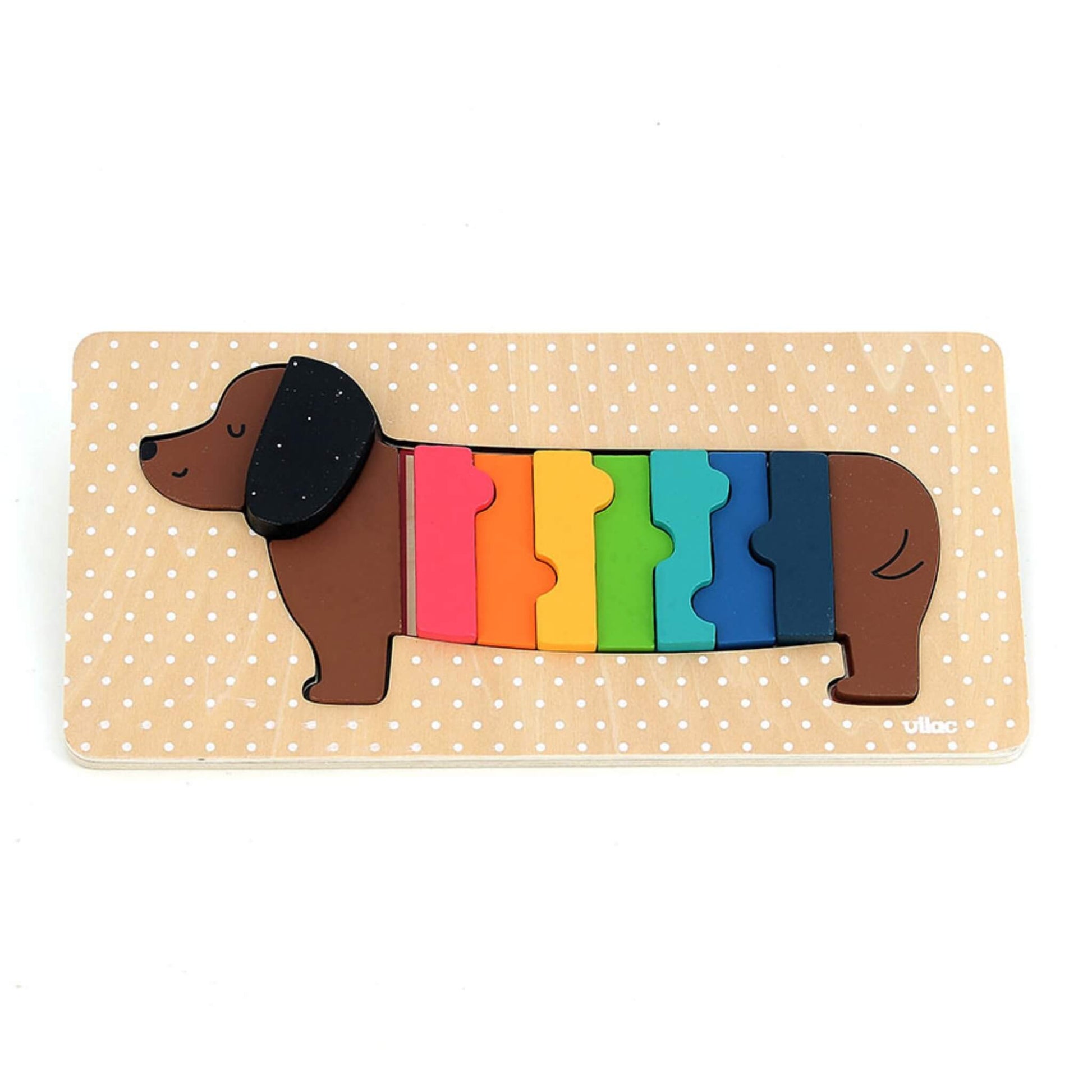 Vilac Andy Westface Wooden Puzzle Dog with rainbow-coloured body pieces assembled on a wooden base.