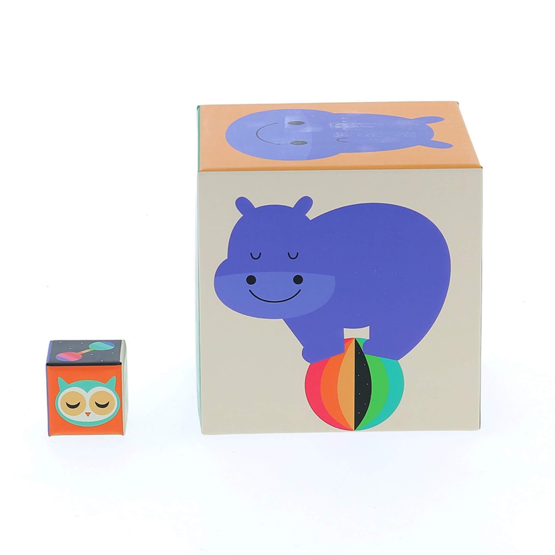 A large cube with a purple hippopotamus illustration next to the smallest cube featuring an owl with closed eyes.