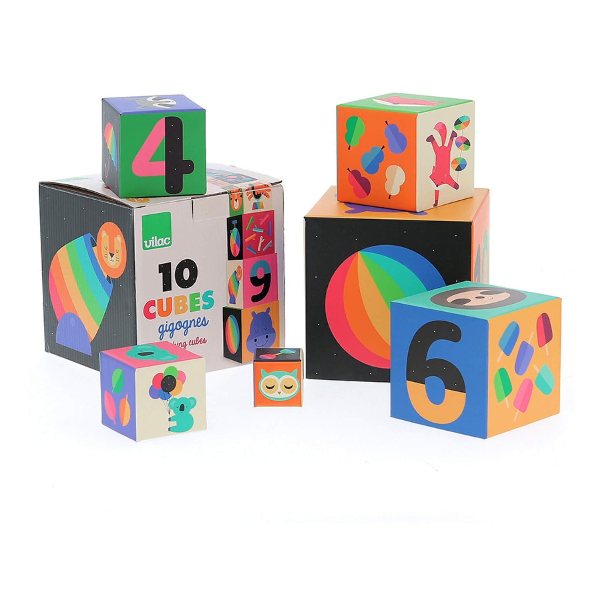 Five illustrated stacking cubes arranged around a cardboard storage box, showing various animals, numbers, and colourful designs.