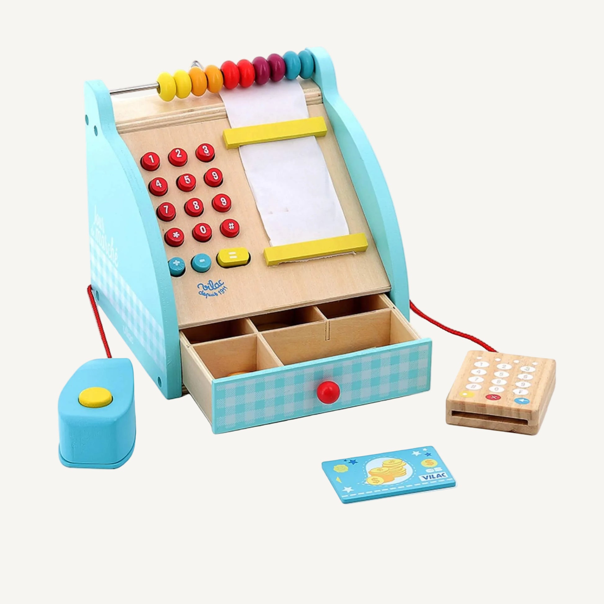 A wooden toy cash register shown front-on with bead abacus, red numbered buttons, paper receipt roll, and open drawer with compartments.