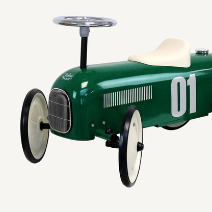 Metal ride-on car with classic racing design, showing large number detail and smooth curved body shape.