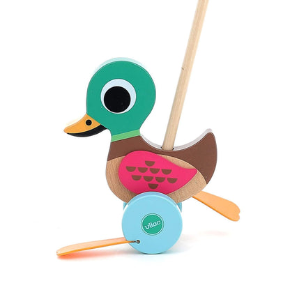 Close-up of the Vilac Duck Push Toy featuring a colourful wooden design, flappy orange feet, and a sturdy handle for toddlers.