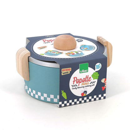 Vilac Early Learning Cooking Pot toy in packaging, featuring wooden handles, a lid, and colourful illustrations designed for toddlers aged 18 months and older.