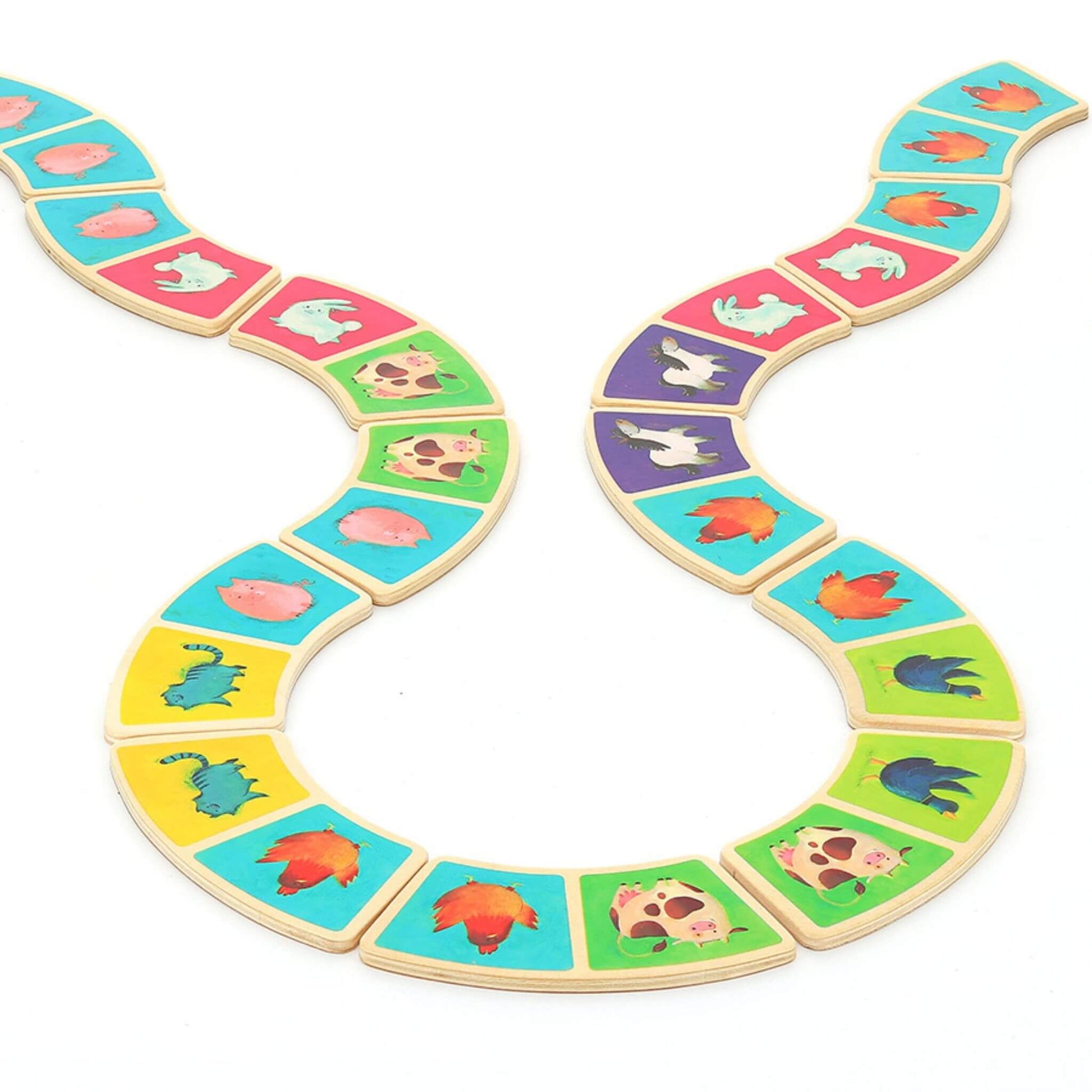 Bright and colourful dominoes arranged in a playful pattern featuring adorable farm animals like cows, pigs, and chickens.