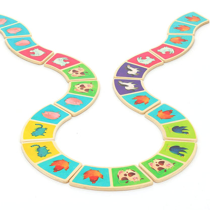 Bright and colourful dominoes arranged in a playful pattern featuring adorable farm animals like cows, pigs, and chickens.