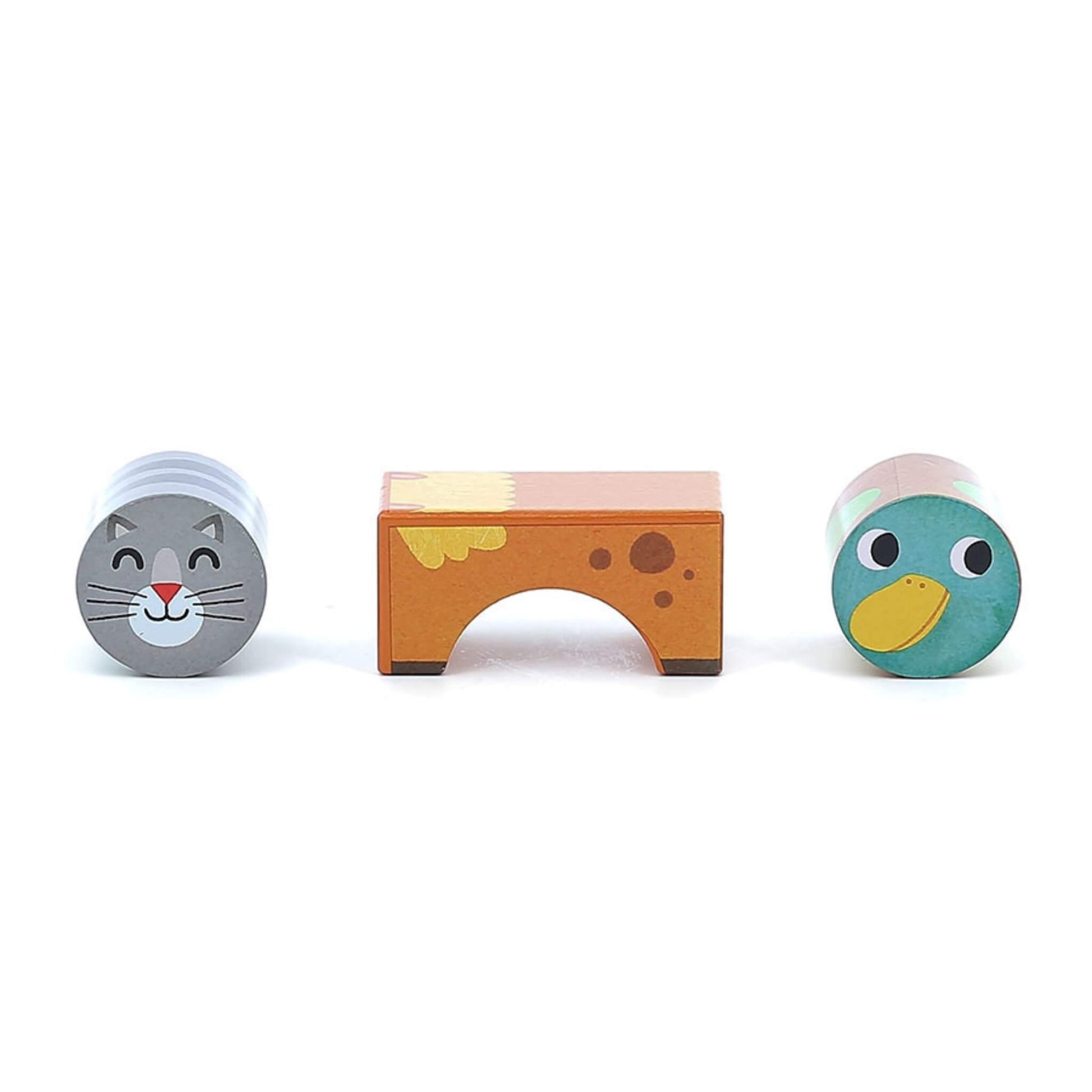 Three wooden blocks displayed separately: a grey cat cylinder, a brown cow arch block, and a green duck cylinder.