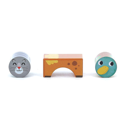Three wooden blocks displayed separately: a grey cat cylinder, a brown cow arch block, and a green duck cylinder.
