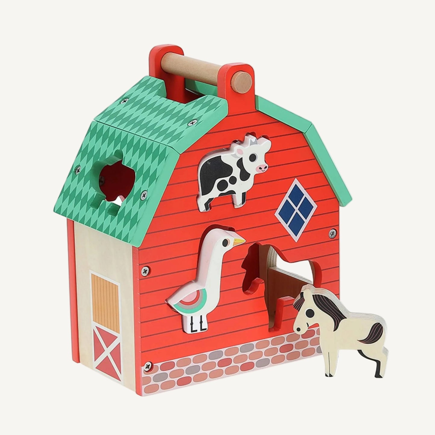 A red wooden toy barn with animal-shaped cut-outs including cow and goose, with horse figure positioned beside the open doorway.