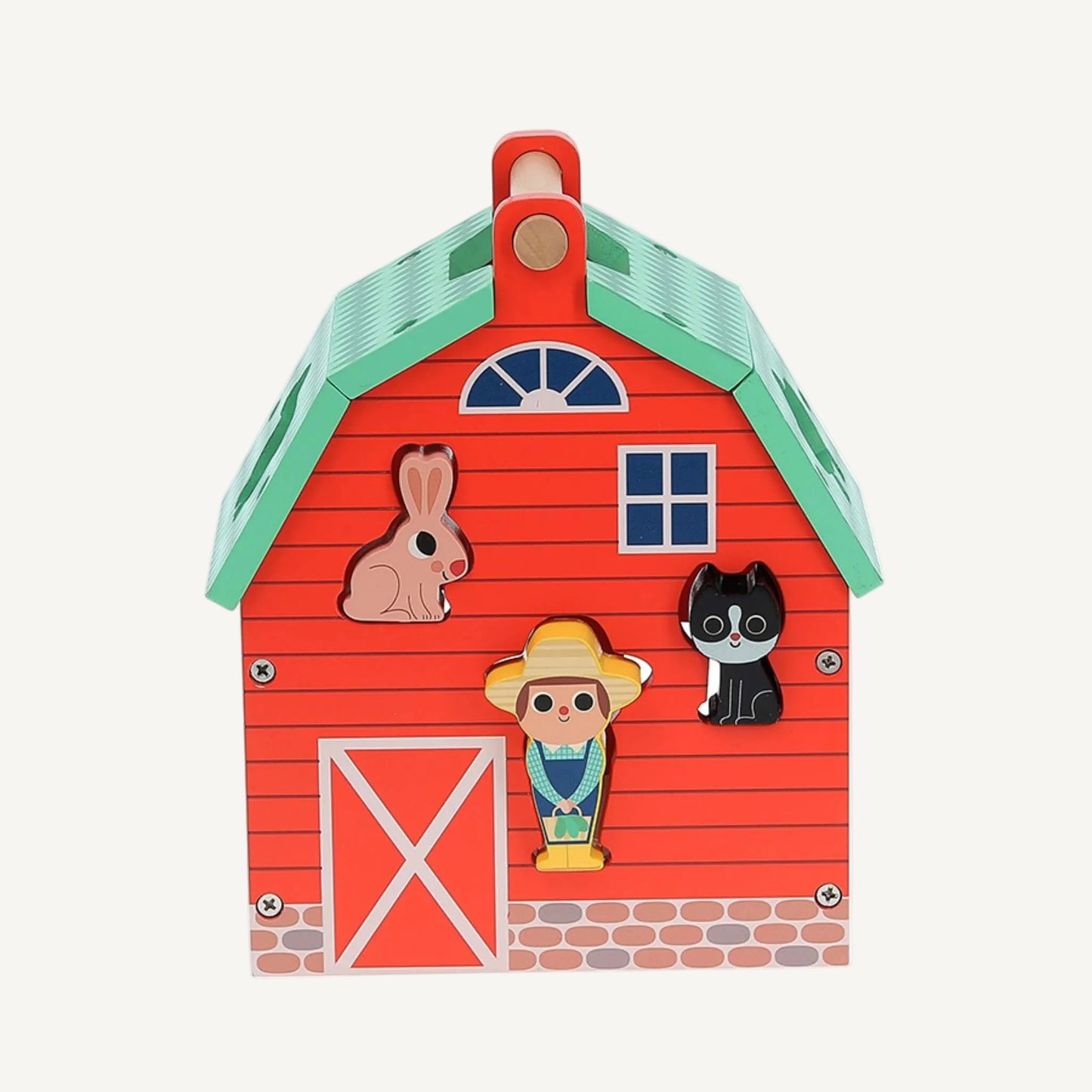 A wooden toy barn front panel showing rabbit, cat and farmer character pieces fitted into matching shape slots on a red barn wall.