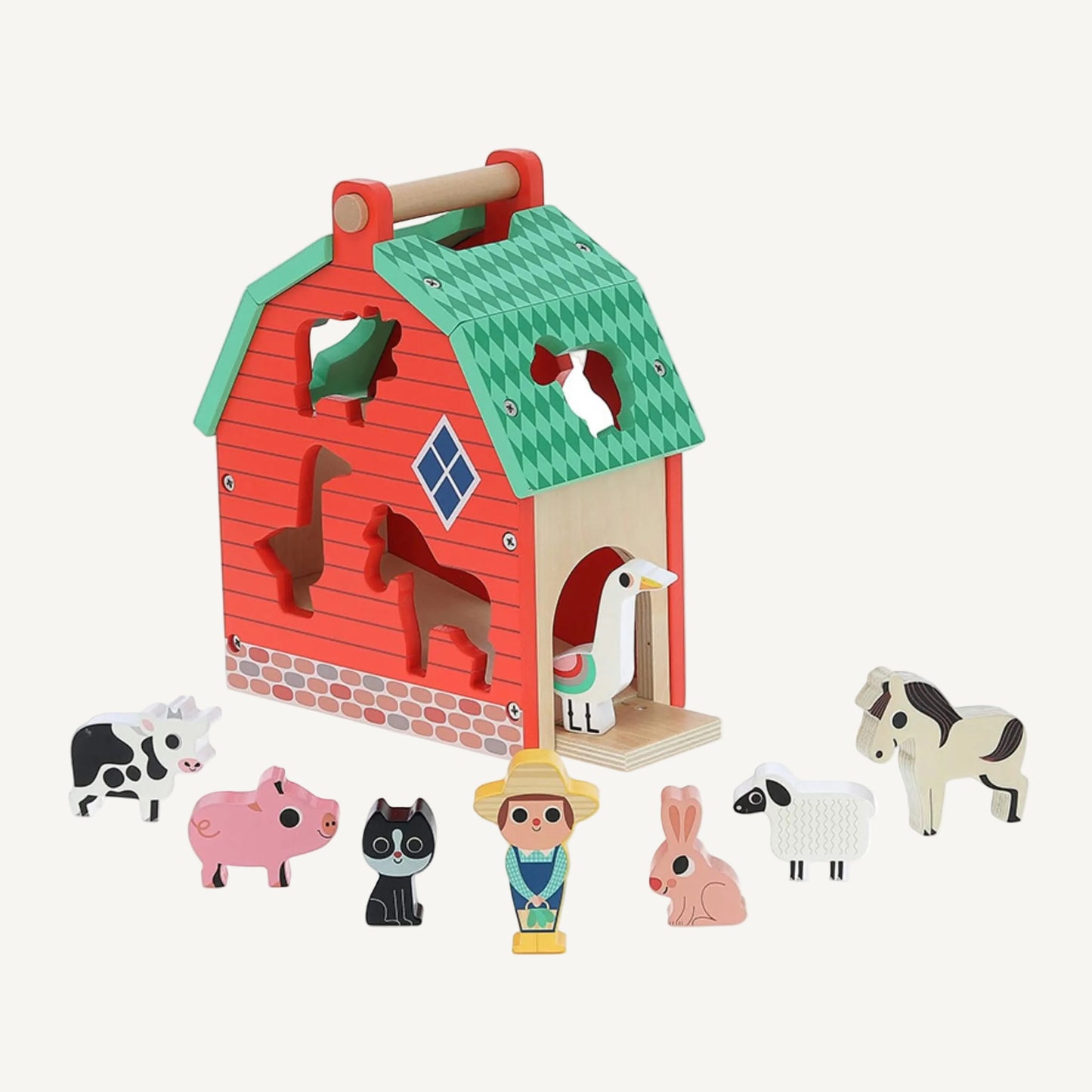 A wooden toy barn with animal figures arranged around it including cow, pig, sheep, horse and goose with farmer figure in centre.