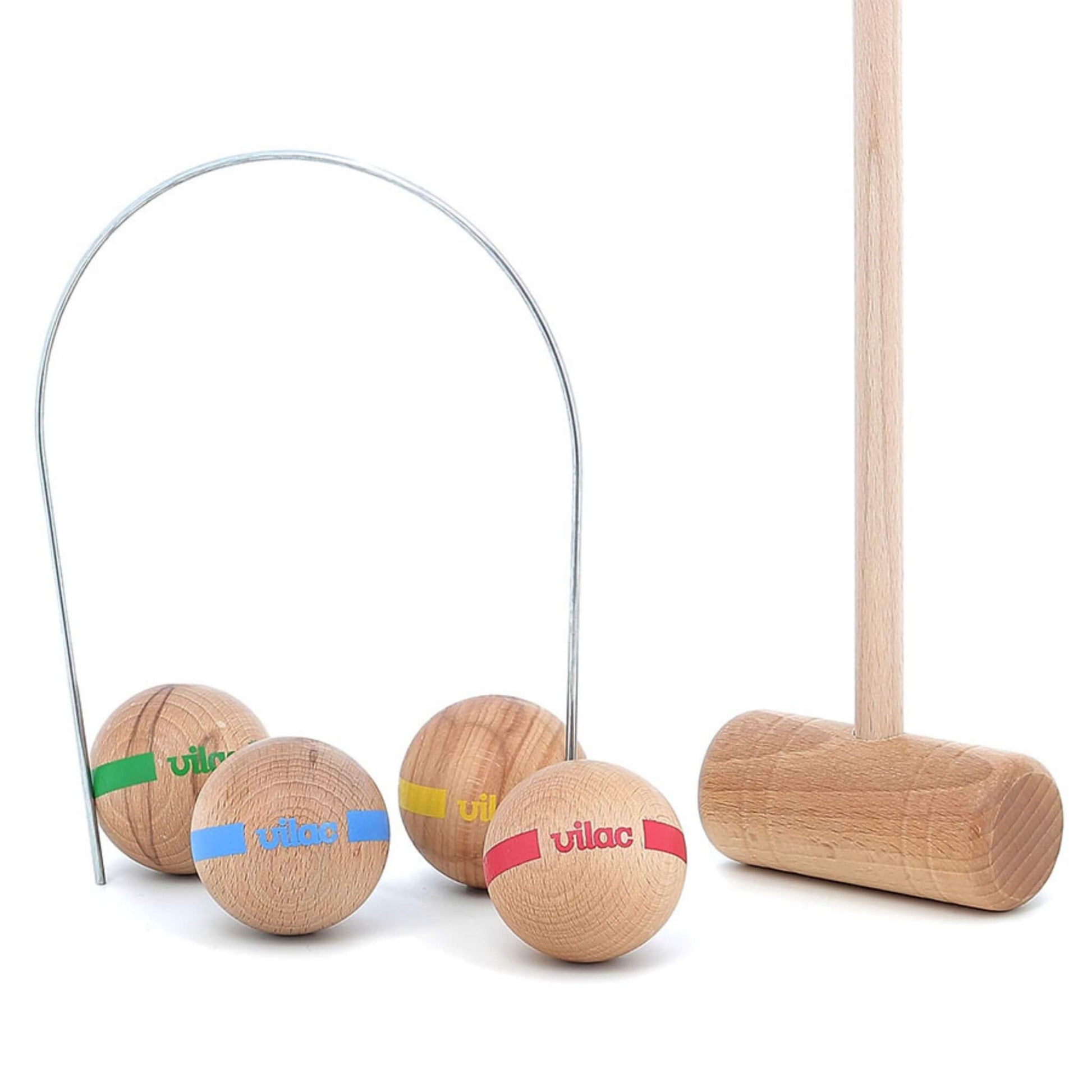 A croquet mallet standing upright next to a metal hoop, with four coloured balls placed underneath.