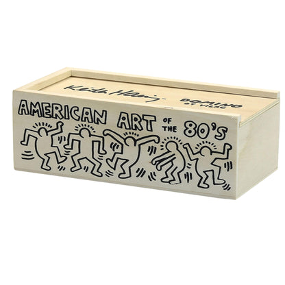 Rectangular wooden storage box with sliding lid, decorated with dancing figure illustrations and the text American Art of the 80’s