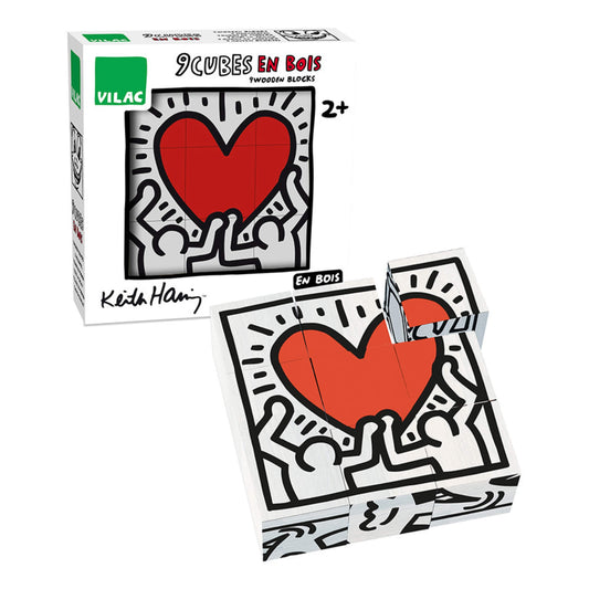 Vilac Keith Haring Wooden Cubes set of 9 blocks in packaging, featuring the iconic red heart design held up by two black line figures.