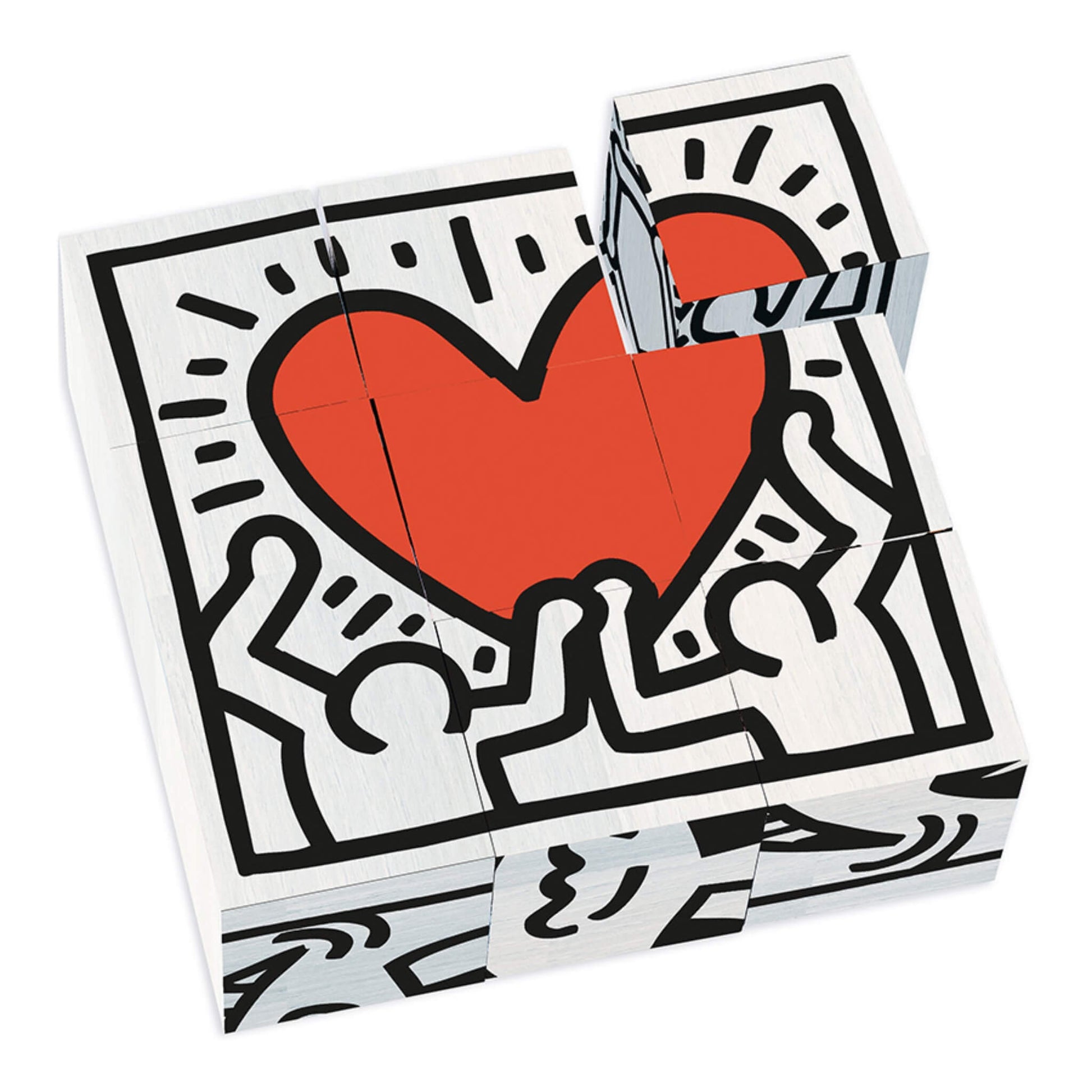 A set of nine wooden cubes arranged to form Keith Haring’s red heart artwork, with one cube lifted to show the puzzle structure