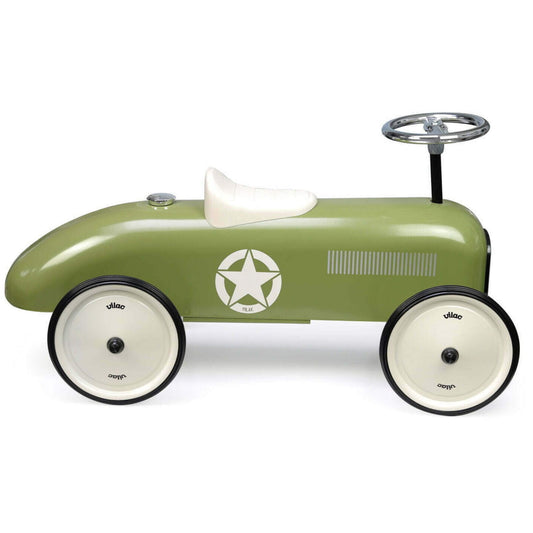 A green metal ride-on car with cream wheels, white seat and steering wheel, against a white background.