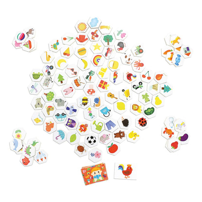 A collection of colourful hexagonal wooden tiles laid out, each featuring an illustrated object such as animals, fruits, toys and everyday items.