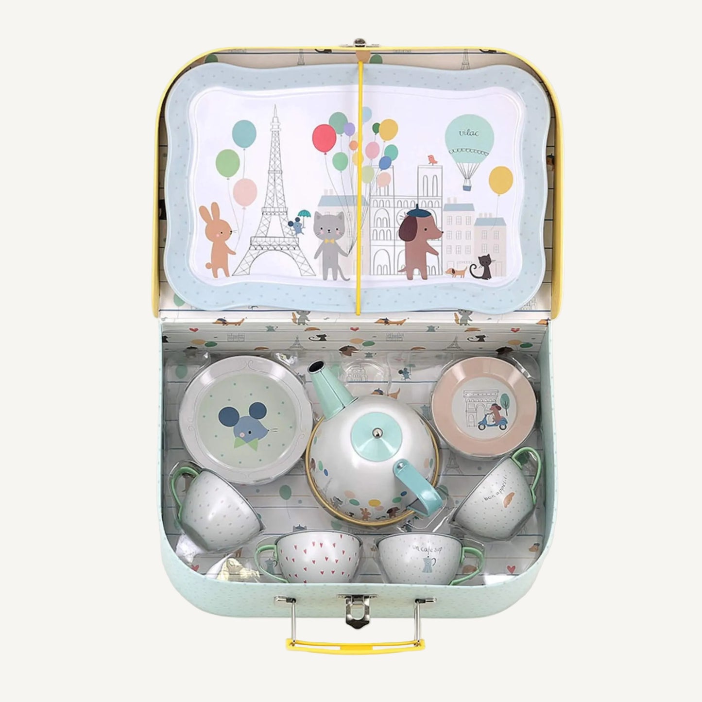 Open tin toy tea set suitcase with metal teapot, cups, saucers and illustrated serving tray inside.