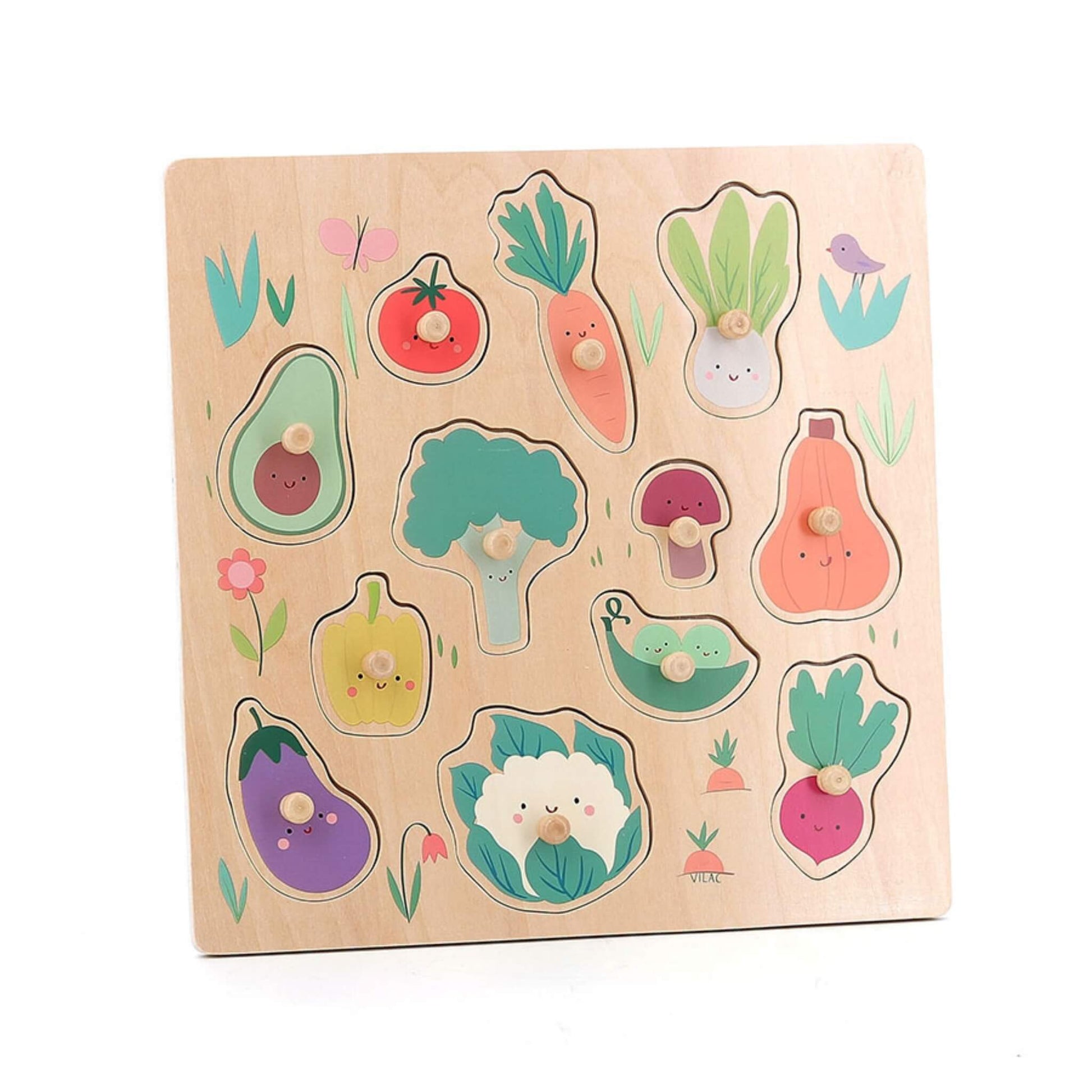 Wooden vegetable peg puzzle board with all pieces in place, showing carrot, tomato, broccoli, aubergine, avocado, peas and more."