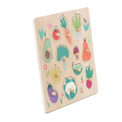 Angled view of vegetable peg puzzle featuring 12 colourful pieces with knobs for small hands to grasp