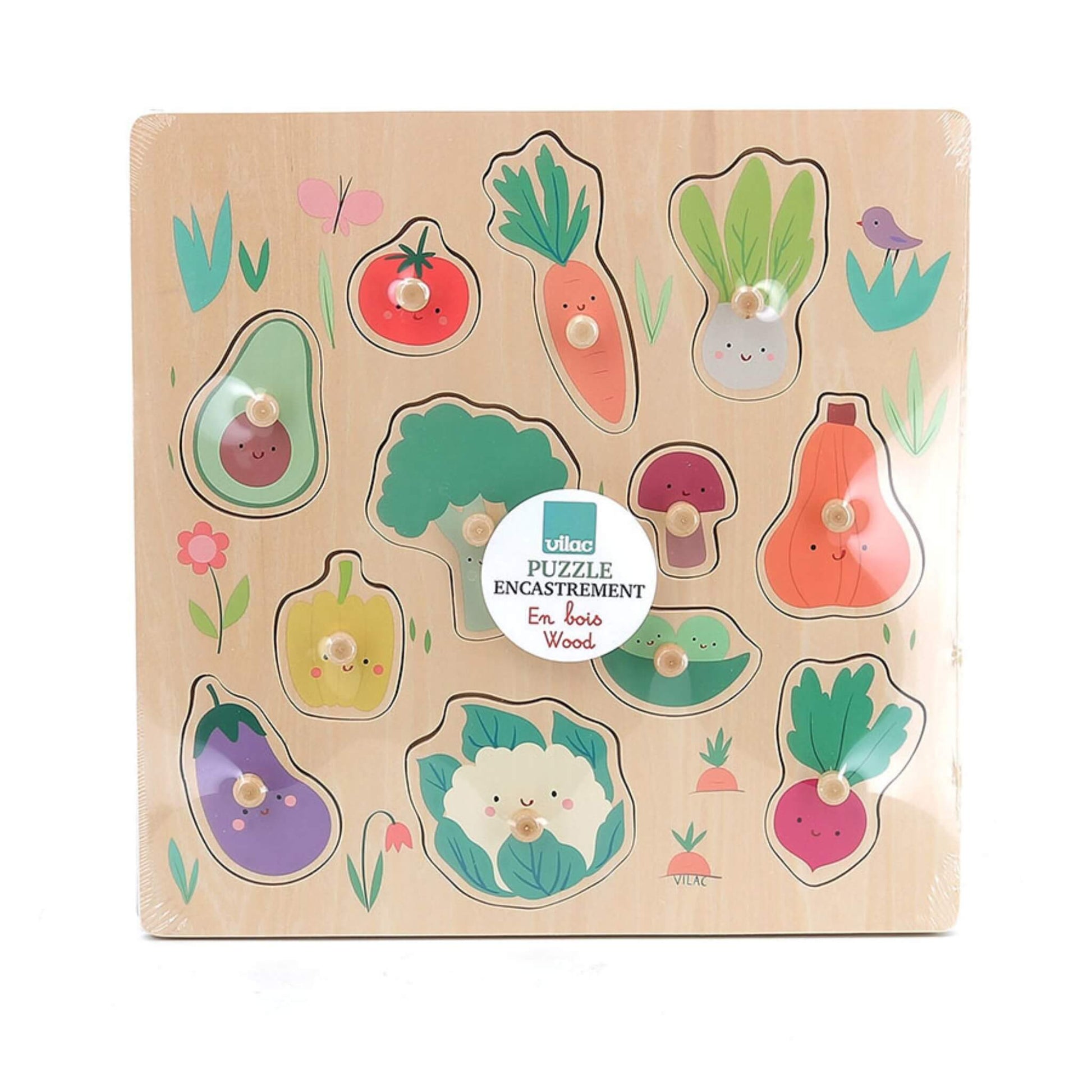 Wooden peg puzzle inside packaging, with illustrated vegetables on the front, labelled as puzzle encastrement.