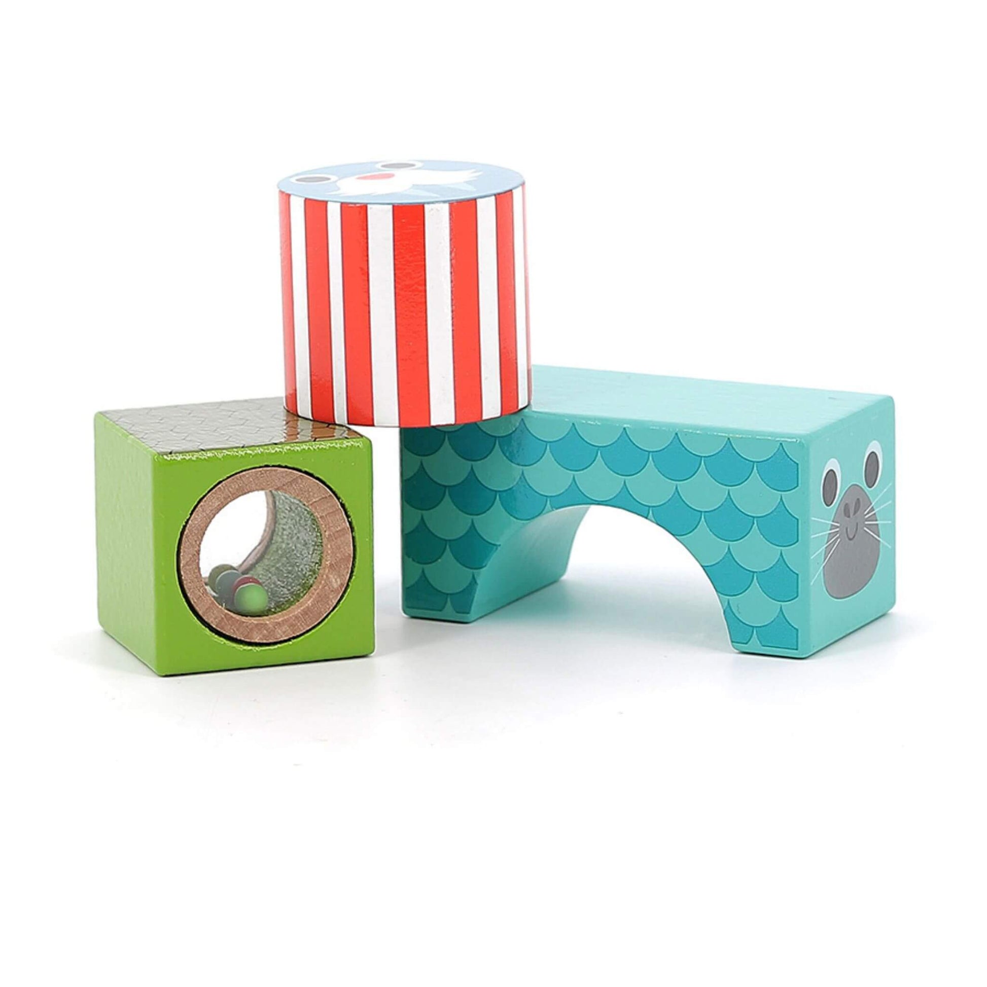 Three Sea Musical Blocks featuring a green block with a rattle window, a striped red cylinder, and a teal arched seal block.