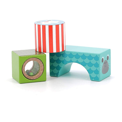 Three Sea Musical Blocks featuring a green block with a rattle window, a striped red cylinder, and a teal arched seal block.