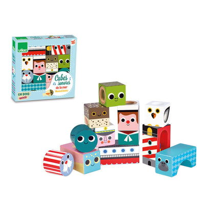 A playful set of wooden Musical Blocks, featuring charming nautical designs like a sailor, seal, lighthouse, and ocean creatures.