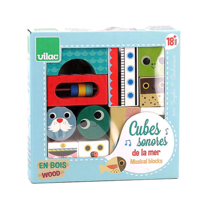 A boxed set of wooden Musical Blocks, featuring ocean-themed characters like a seal and lighthouse, perfect for creative play.