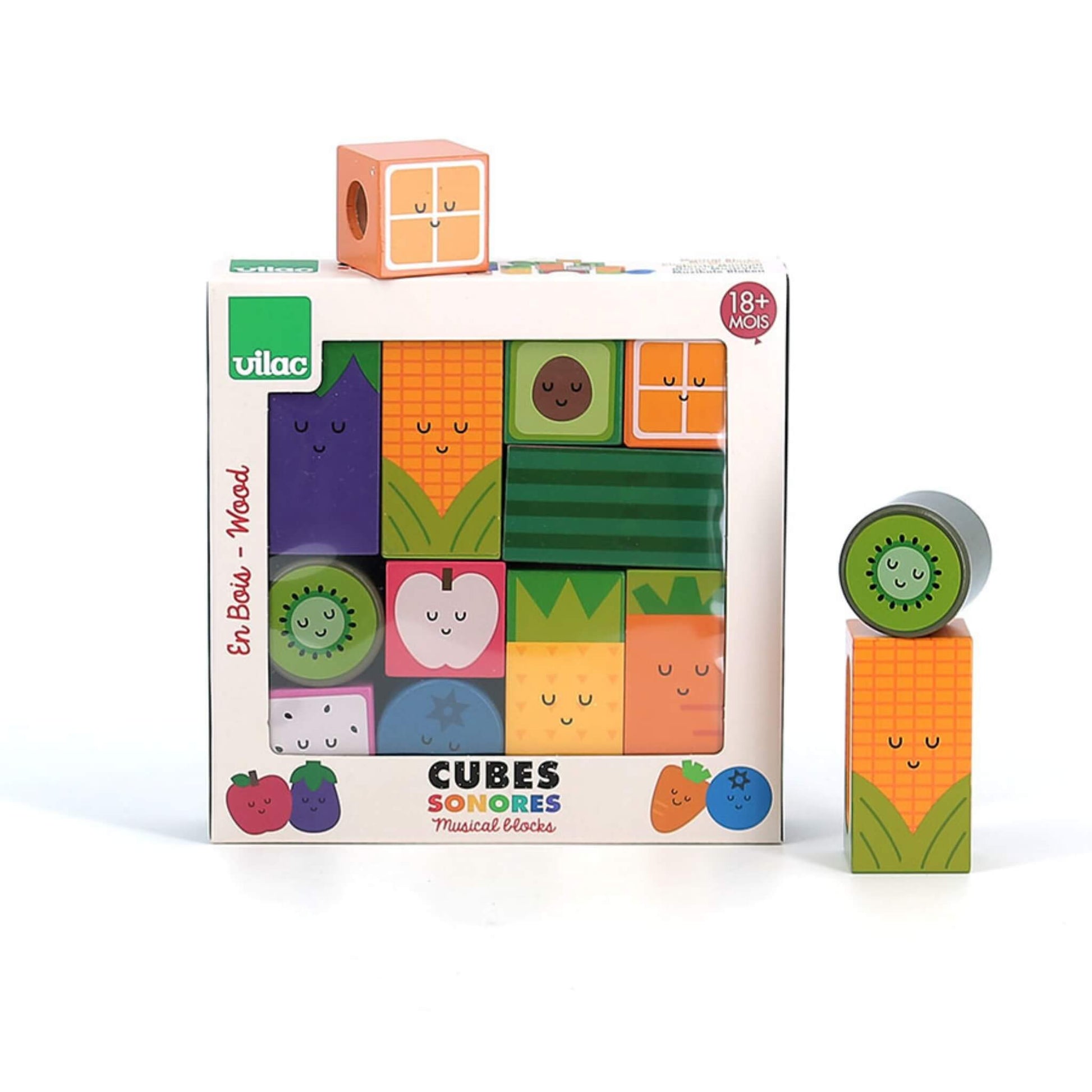 Wooden fruit and vegetable blocks positioned around a packaging box with kiwi and corn blocks stacked on top of each other.