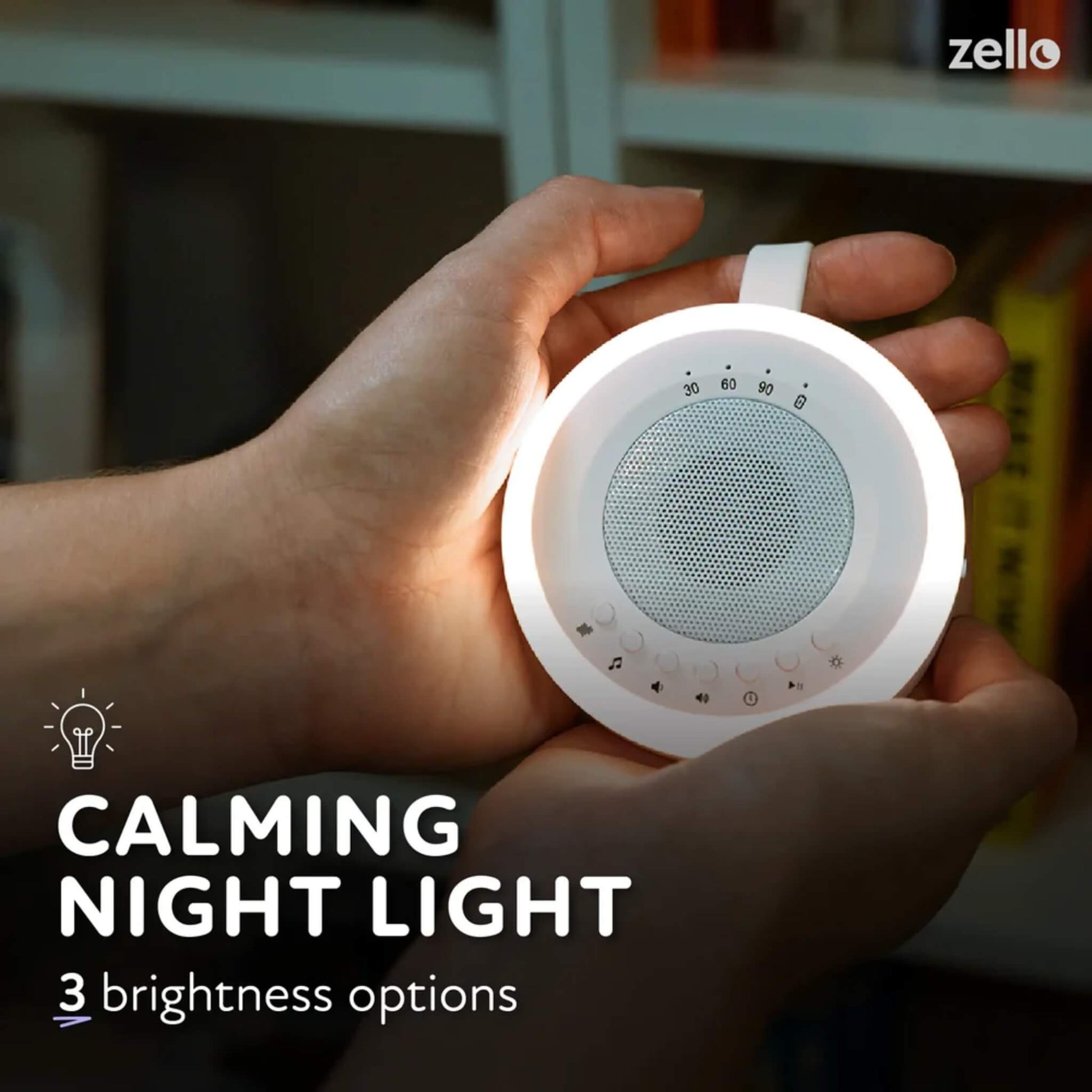 Portable night light sound machine glowing in hands, with overlay noting three adjustable brightness levels for bedtime comfort.