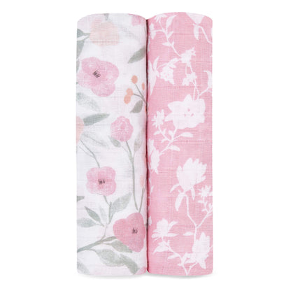 Two Aden + Anais muslin swaddles in Ma Fleur print, featuring soft floral designs in pink and white, made from breathable cotton muslin.