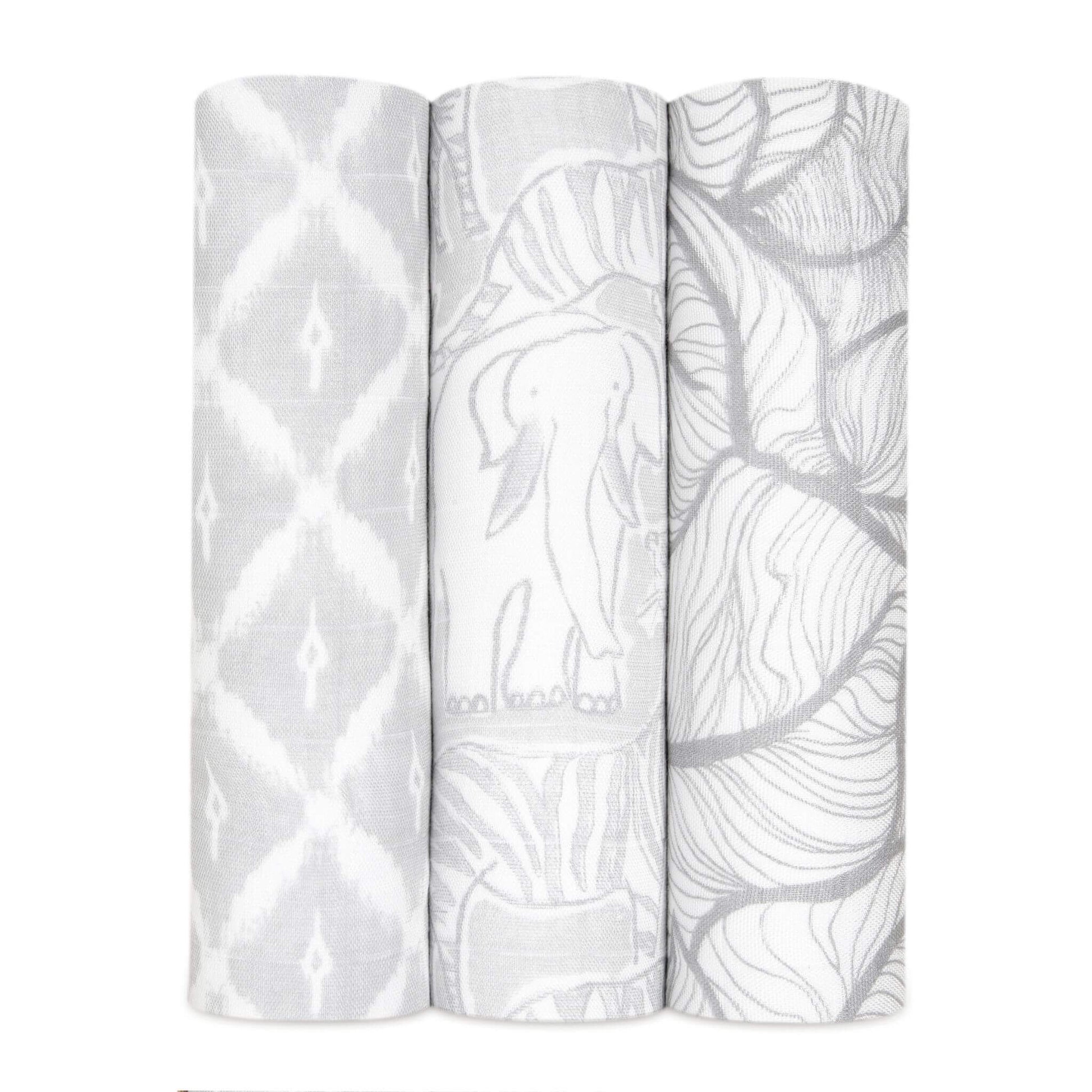 Rolled 3-pack Culture Club Silky Soft aden + anais Swaddles featuring delicate grey and white patterns, made from breathable bamboo muslin.