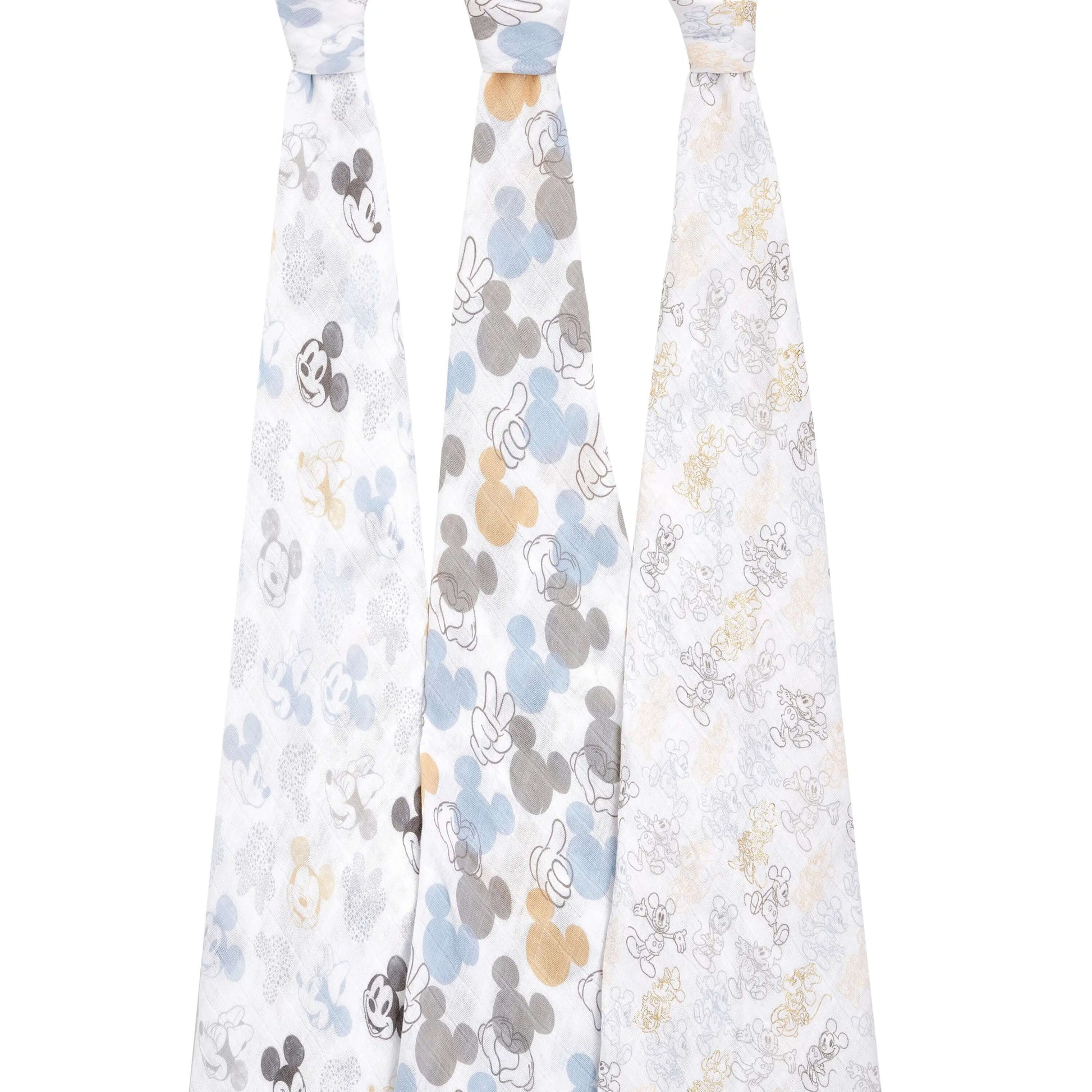 Three aden + anais cotton swaddles hanging to show full Mickey and Minnie print designs in grey, blue, beige, and gold tones.