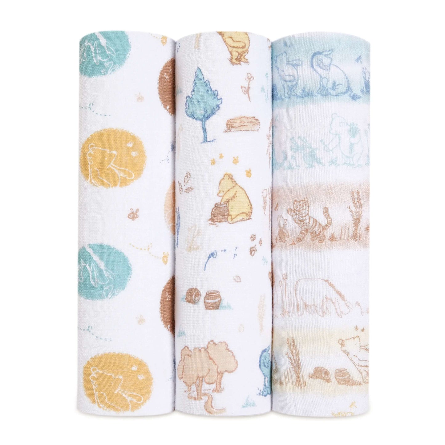 Set of three aden + anais Boutique Cotton Muslin Swaddles with Winnie the Pooh prints in earthy tones and hand-drawn woodland scenes.