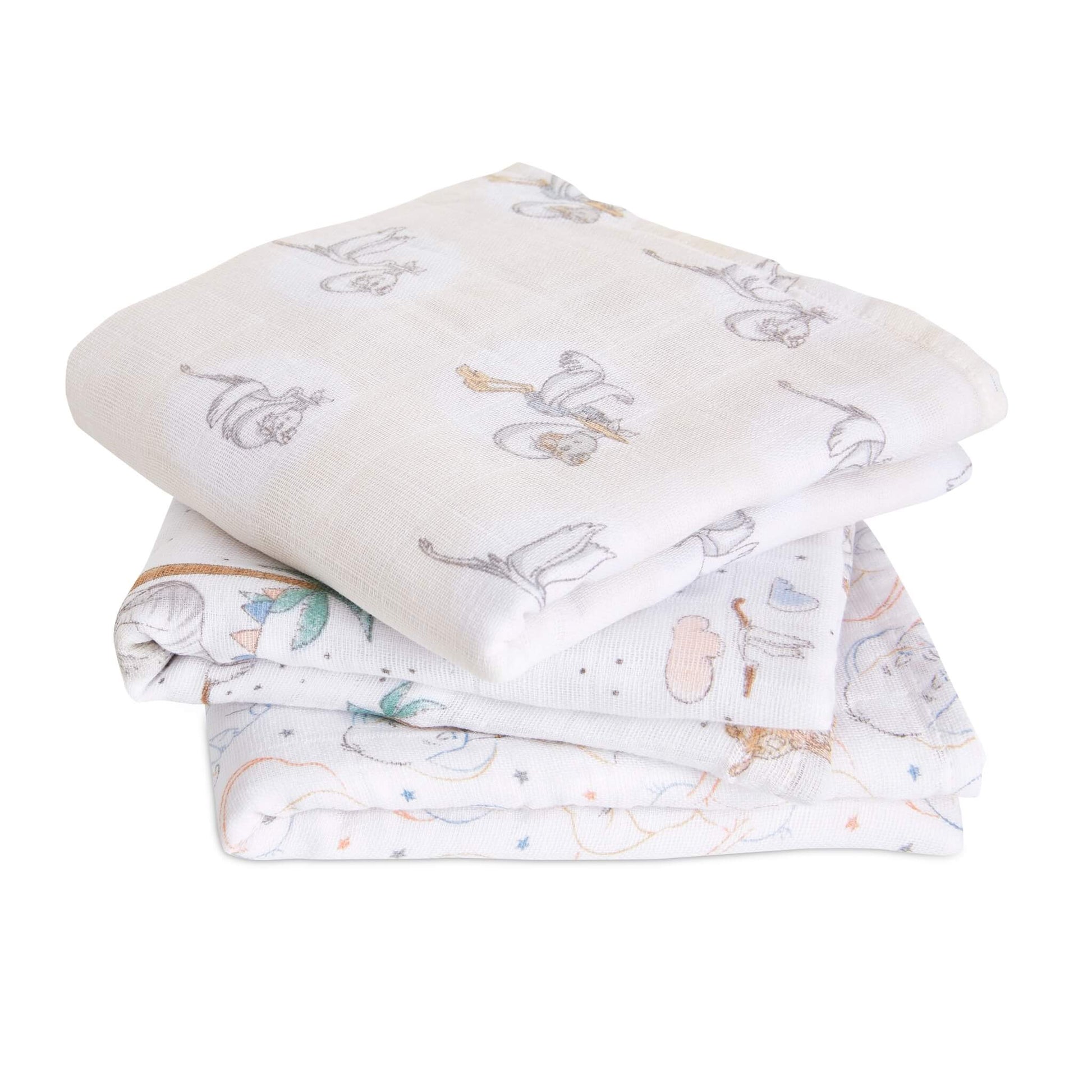 Stack of three cotton muslin squares with soft Disney Dumbo illustrations in gentle neutral and pastel tones.