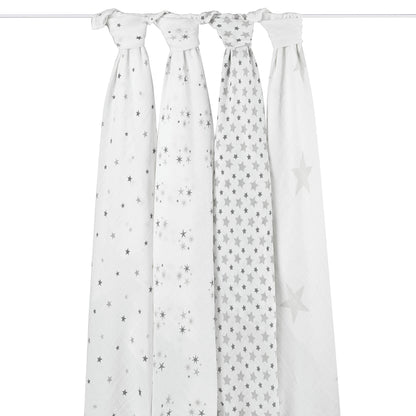 Hanging aden + anais Twinkle swaddles. Four cotton muslin blankets with star prints. Lightweight and ideal for newborn swaddling.
