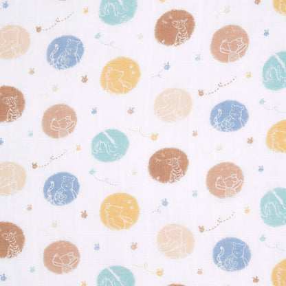 Fabric swatch of aden + anais cotton muslin swaddle featuring Winnie the Pooh character outlines in multicoloured dot pattern.