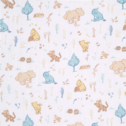 Fabric swatch of aden + anais cotton muslin swaddle with hand-drawn Winnie the Pooh, Tigger, Piglet, and Eeyore in a whimsical forest scene.
