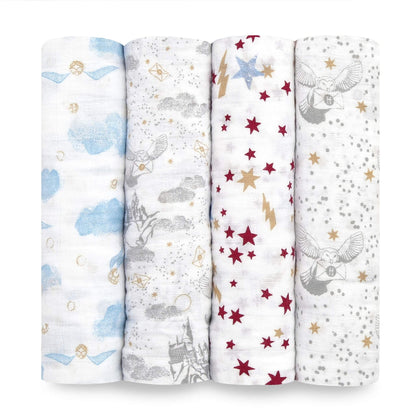 Four rolled aden + anais Harry Potter™ muslin swaddles featuring themed prints with clouds, owls, stars and Hogwarts™ illustrations.