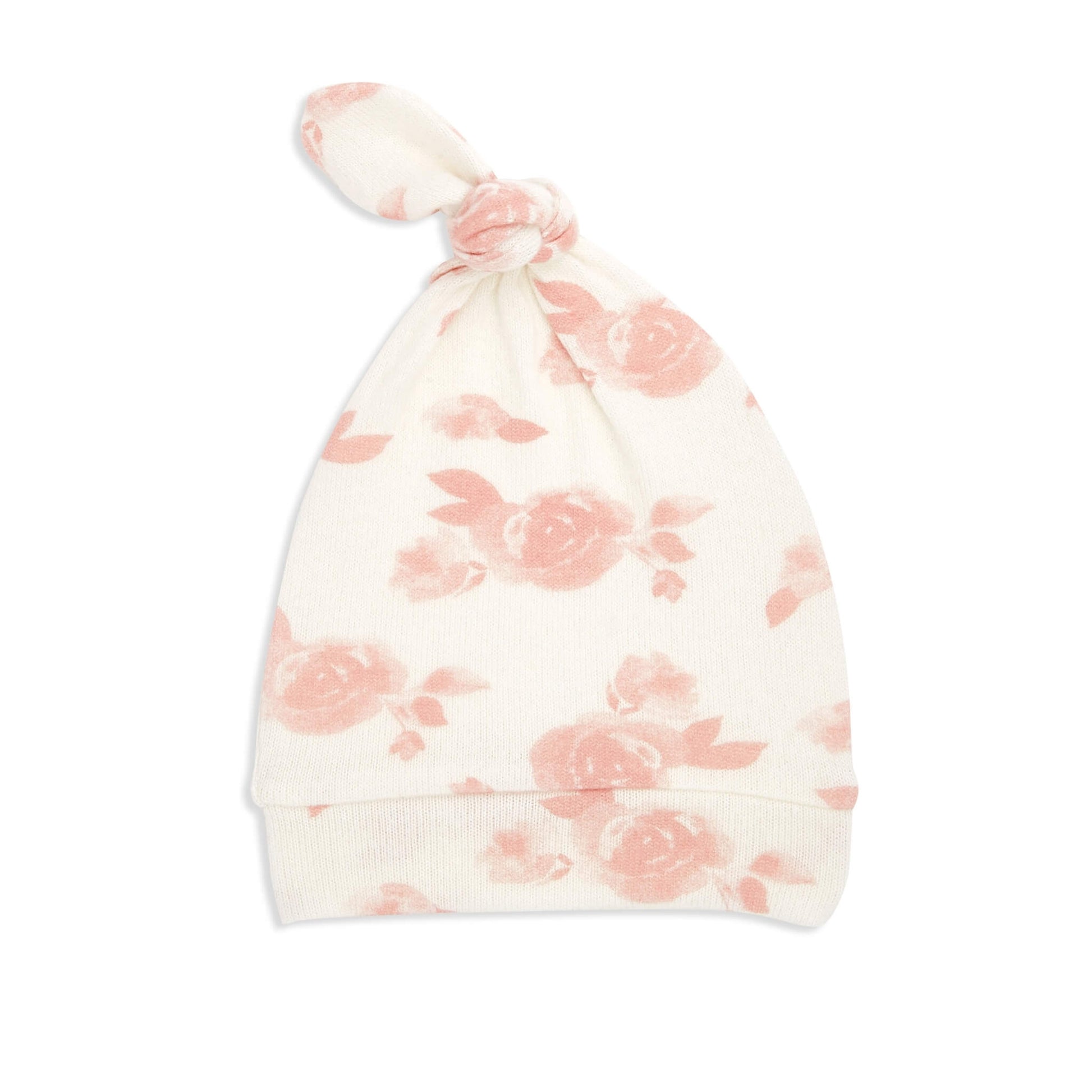 Knotted newborn hat from the aden + anais Rosettes gift set. Made from soft stretch knit in cream with pink rose pattern.