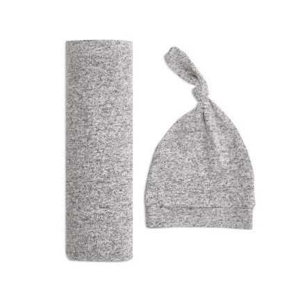 Soft, stretchy aden + anais Snuggle Knit Swaddle & Hat Gift Set in Heather Grey, featuring a rolled swaddle blanket and matching knotted newborn hat.