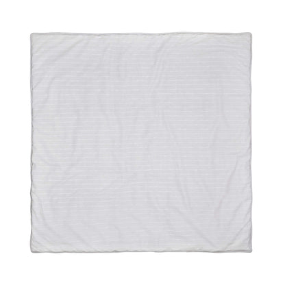 Back view of the aden + anais baby playmat showing the plain cotton canvas reverse side in neutral grey with subtle stitched lines.