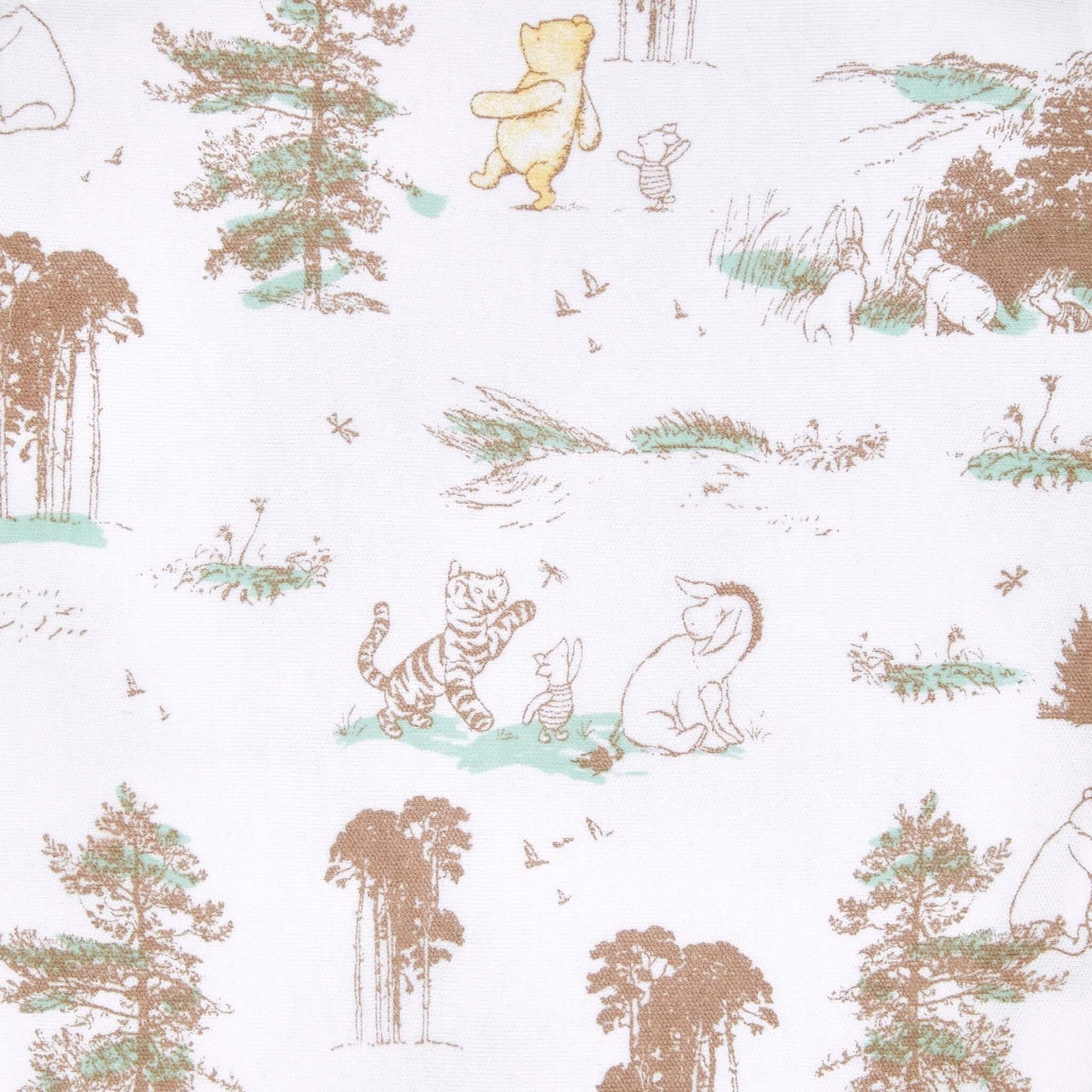 A close-up of white swaddle fabric with illustrations of Winnie the Pooh, Piglet, Tigger, and Eeyore among trees, grass, and flying birds.