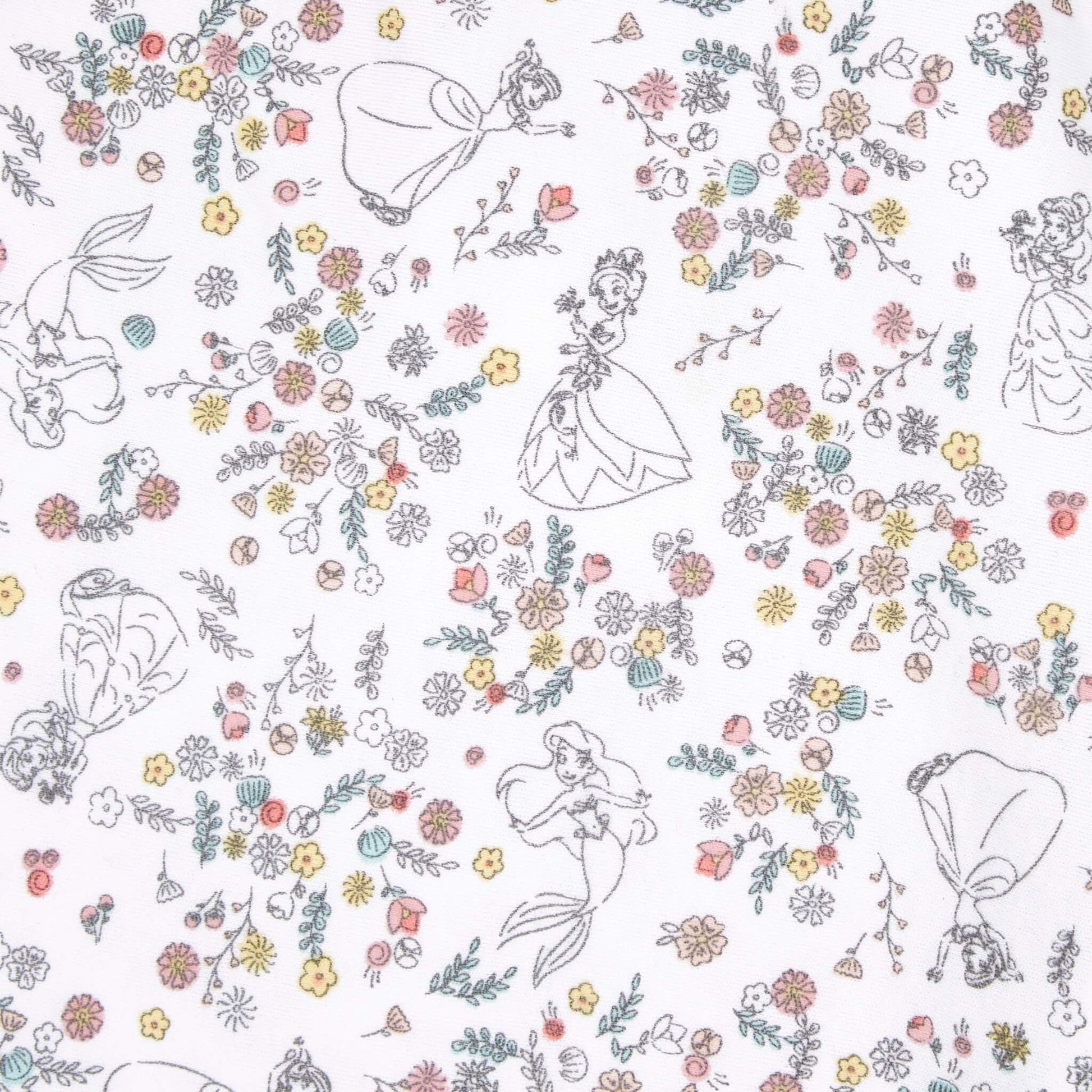 A close-up of the white swaddle fabric featuring fine line drawings of princesses such as Ariel and Tiana scattered among clusters of pastel flowers.