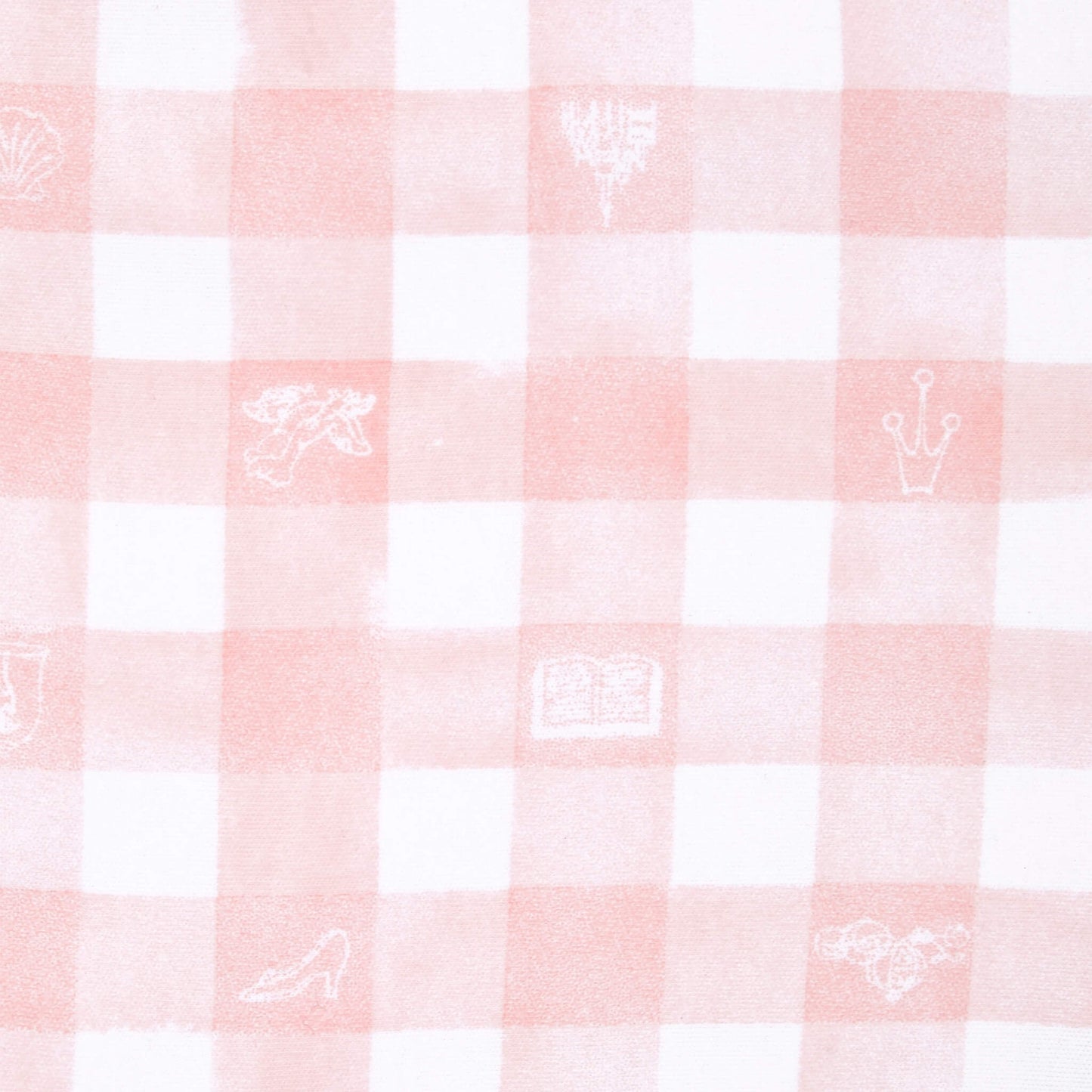A close-up of the pink and white gingham swaddle with small white illustrations including a crown, book, slipper, and other princess-themed icons.