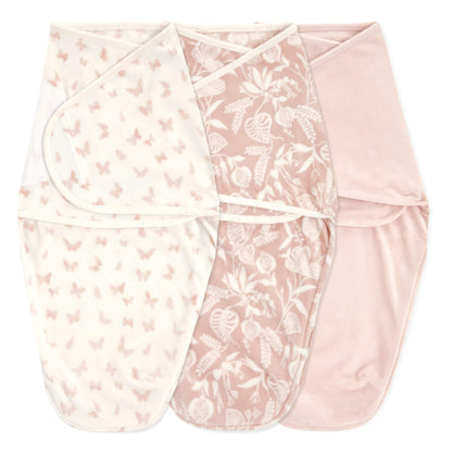 Set of three aden + anais Essentials Velboa Wrap Swaddles in soft pink garden-themed designs.
