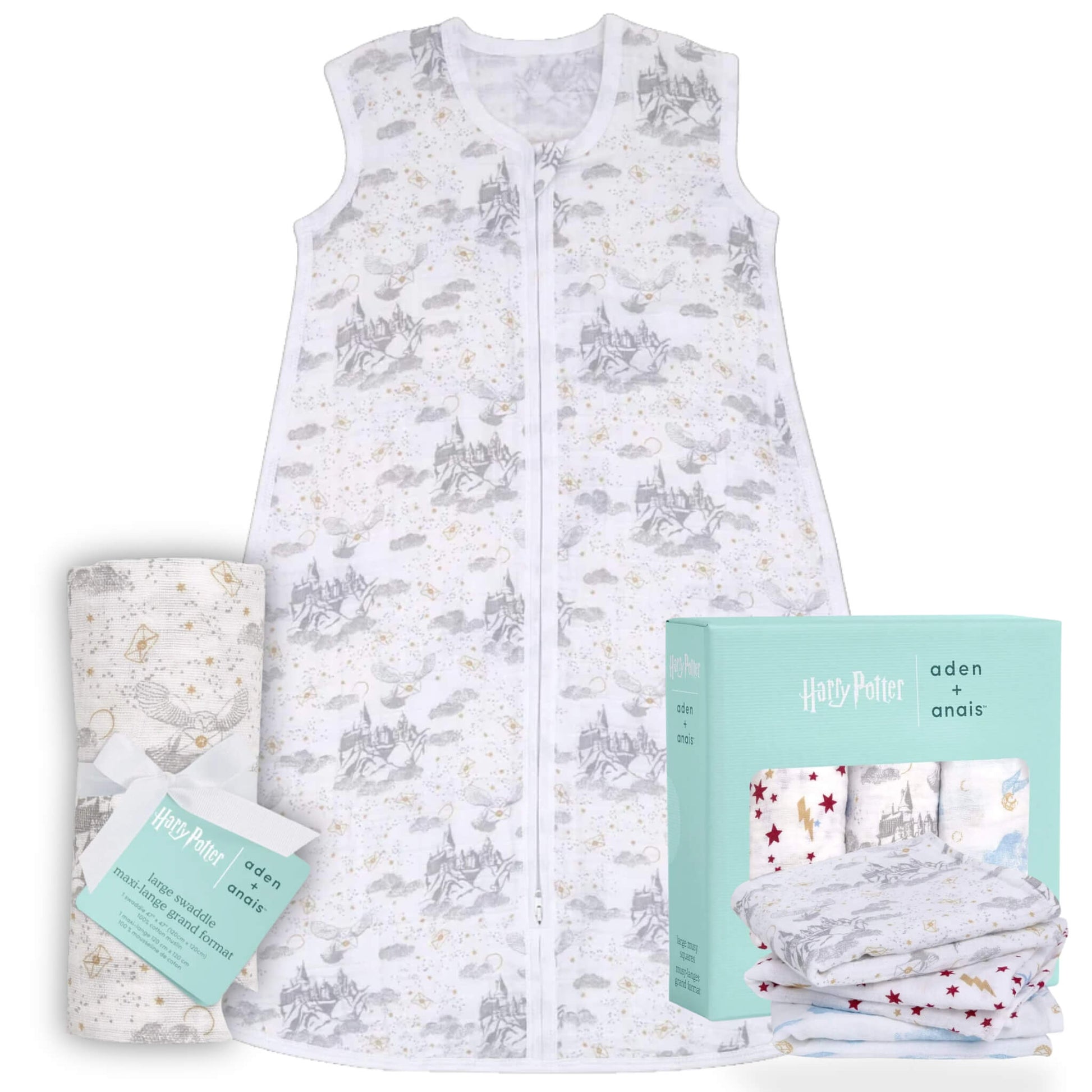 Soft cotton muslin sleeping bag with grey Hogwarts castle illustrations displayed alongside folded muslin squares and matching mint green packaging on a pale warm background.